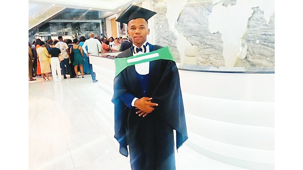Meluleki Nkambule in his first graduation gown from IDM.